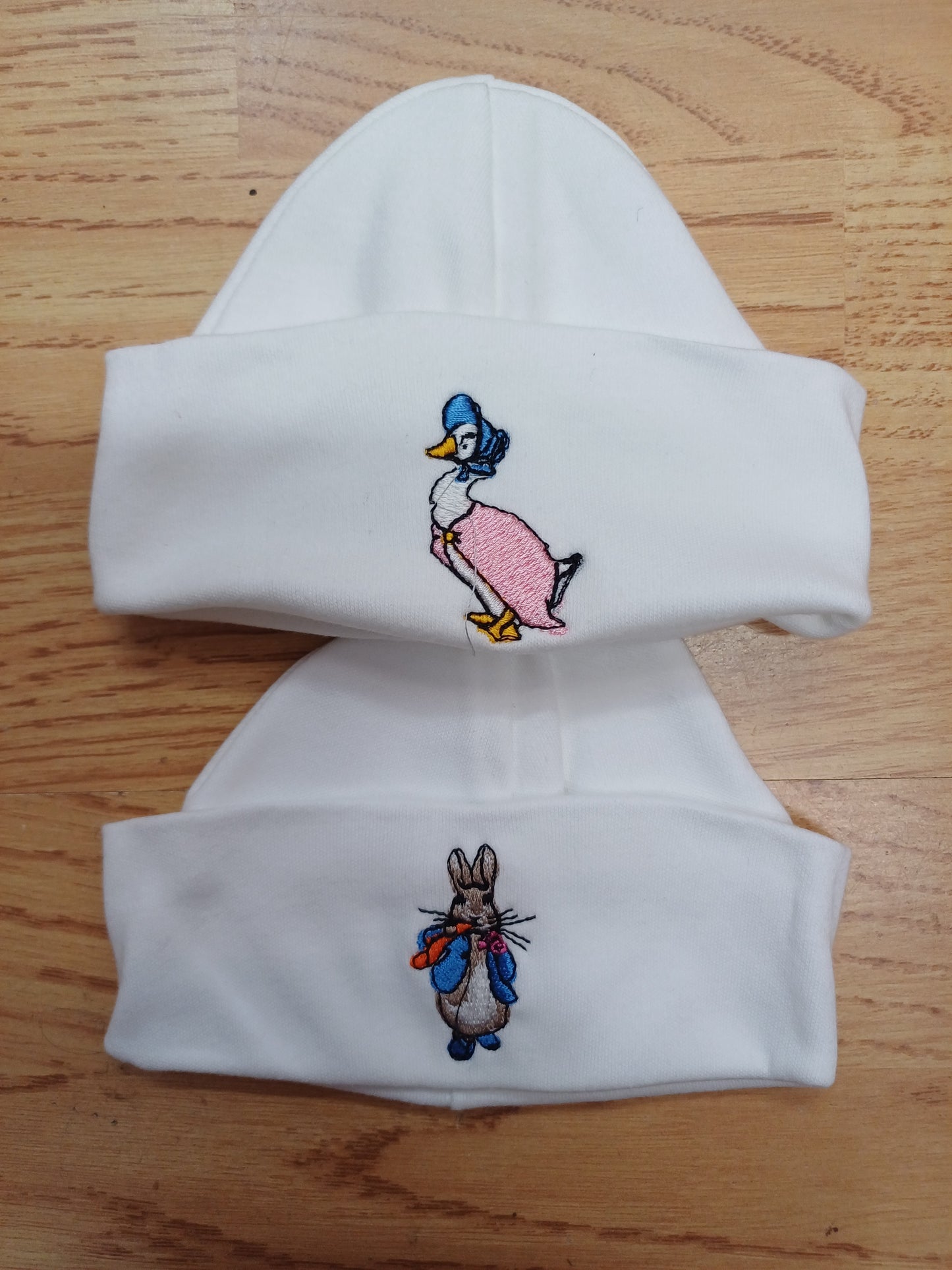 Baby Boys or girls 100 % soft cotton hat embroidered with peter rabbit or jemima puddle duck size newborn