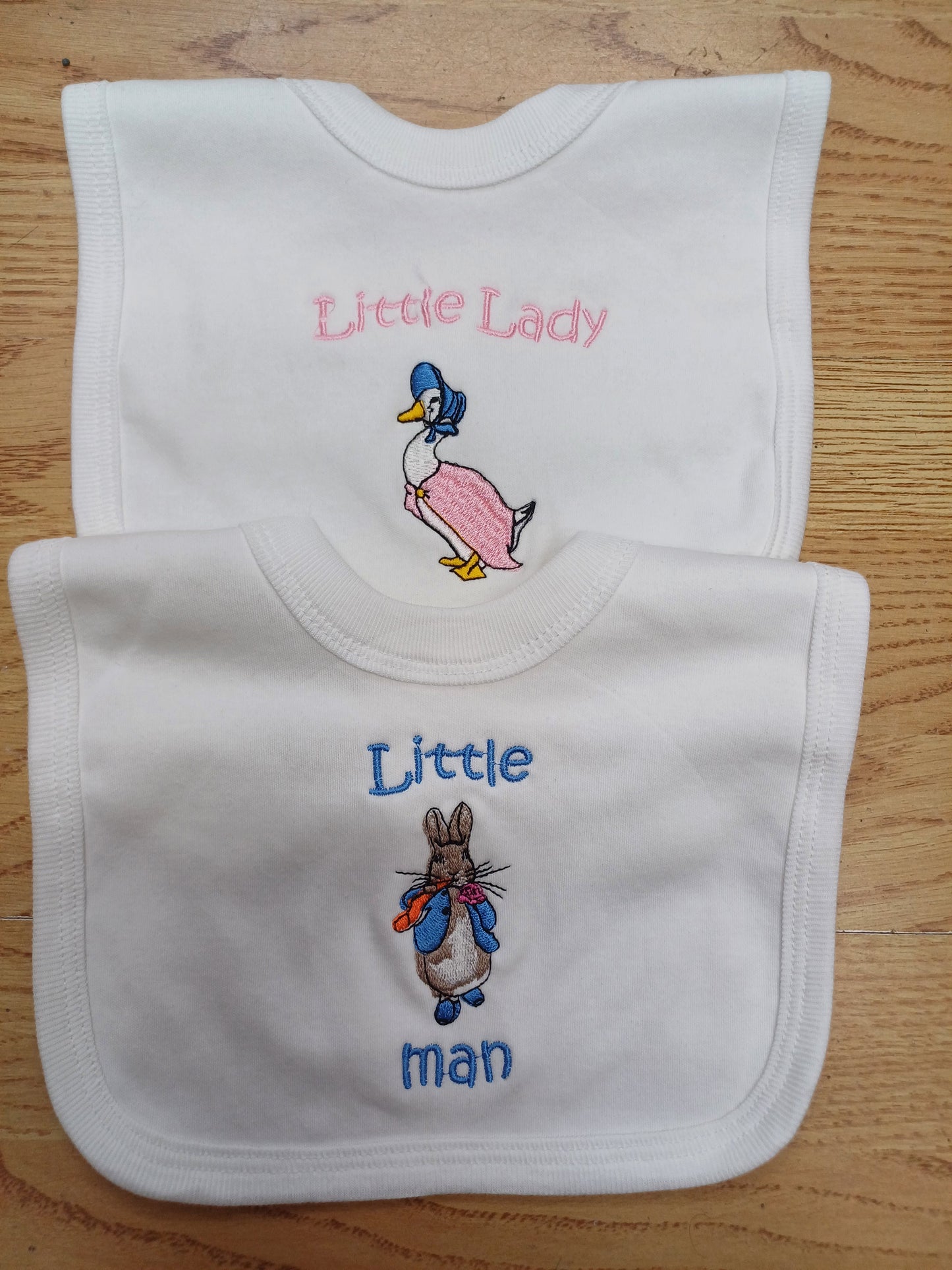 Baby Boys or girls 100% soft cotton bib embroidered with peter rabbit or jemima puddle duck