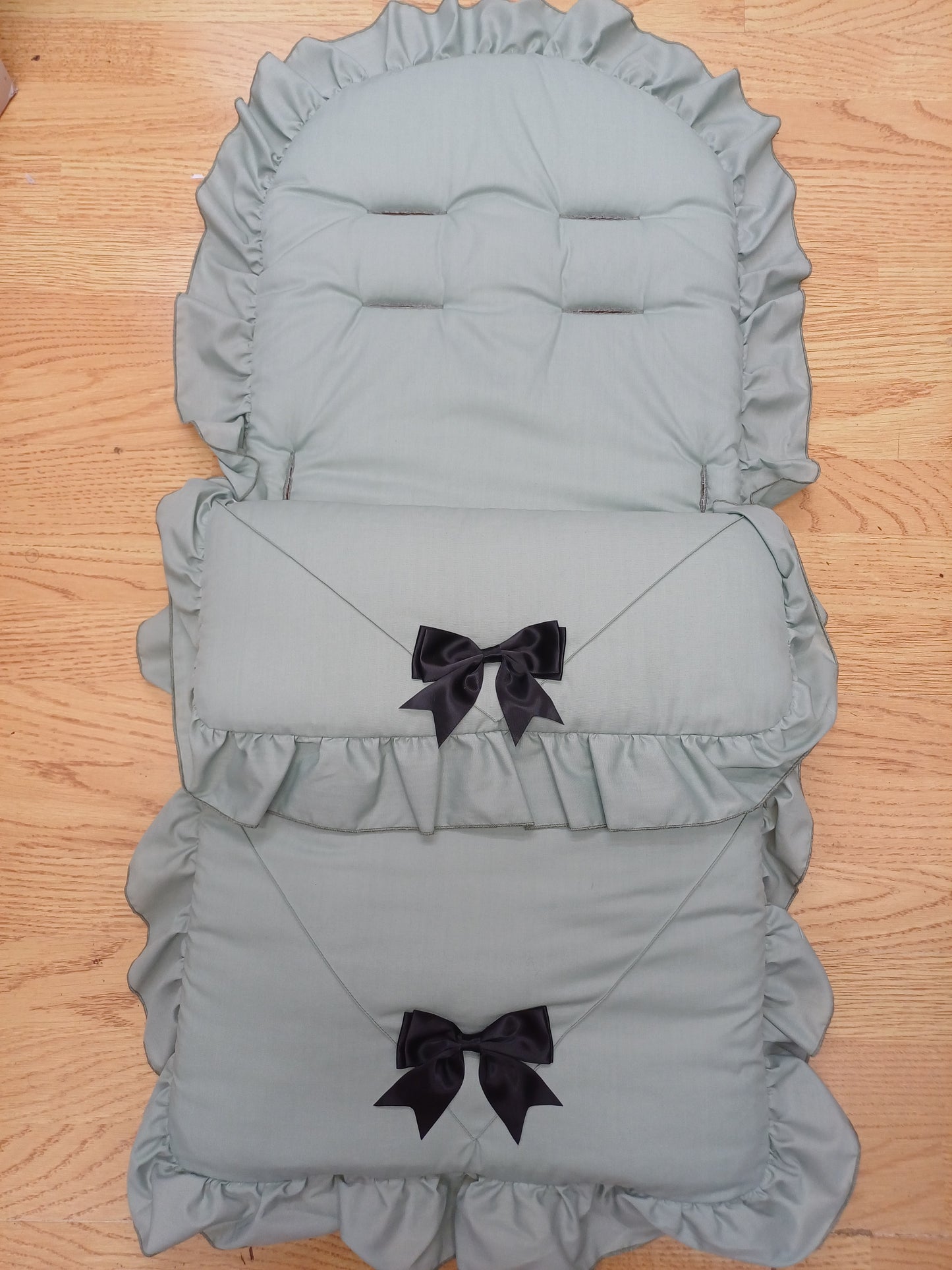 Babys boys or girls universal pram cosytoes footmuff pram set with bows colour sage green / black bows