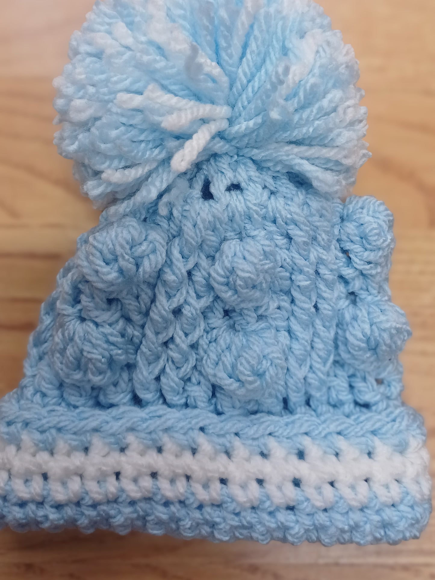 Babys handmade crocheted cardigan and pom hat set