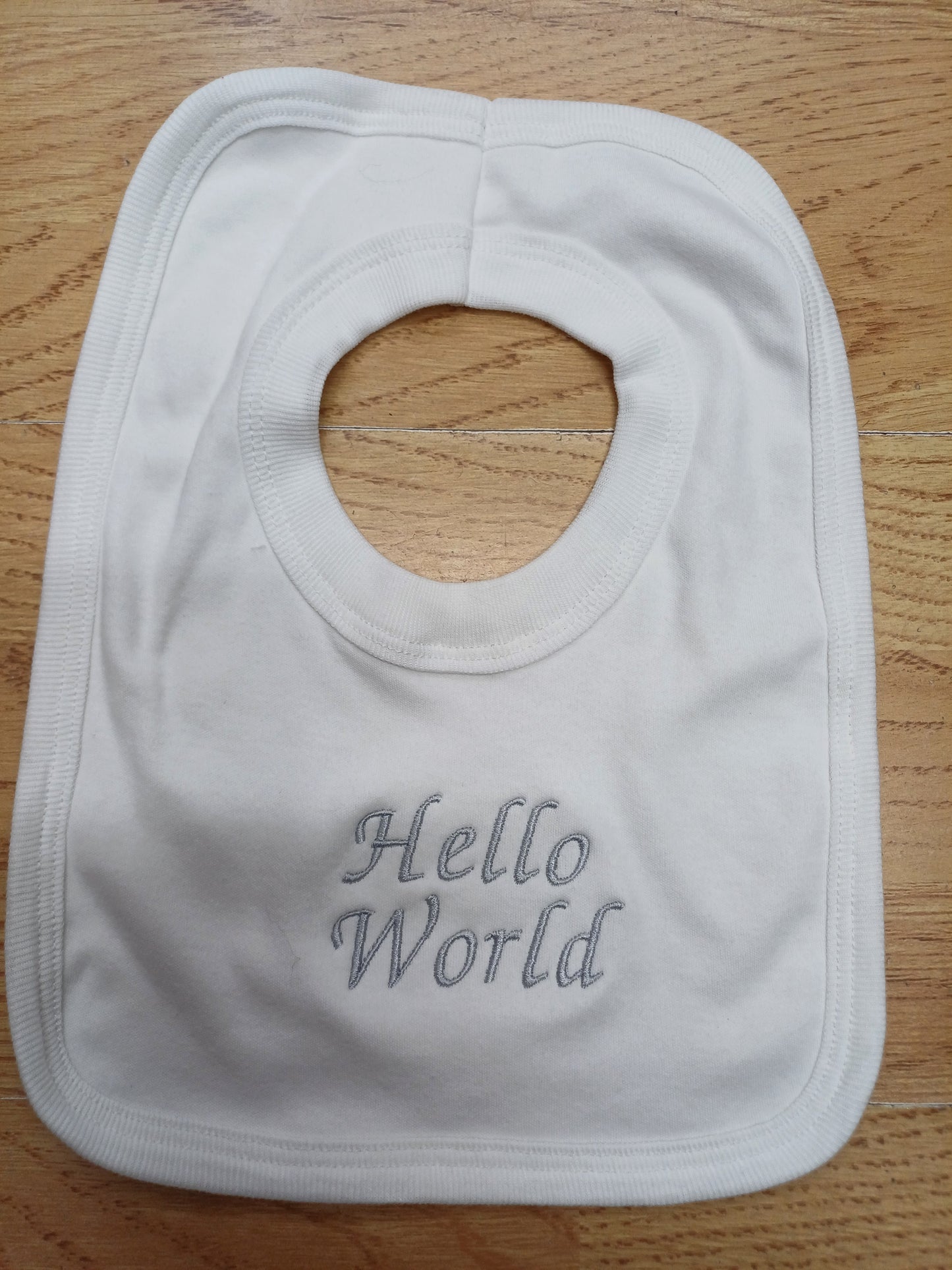 Babys cotton bib embroidered with just arrived or hello world