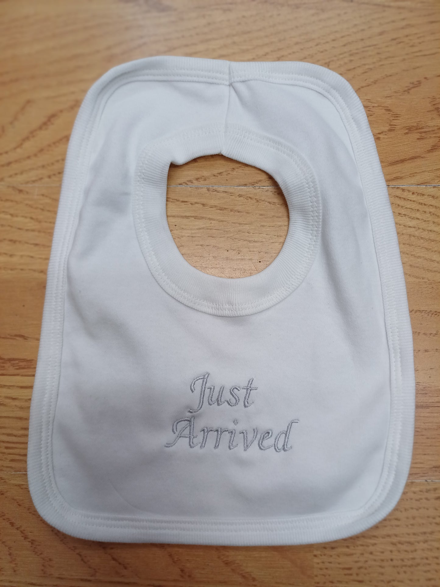 Babys cotton bib embroidered with just arrived or hello world