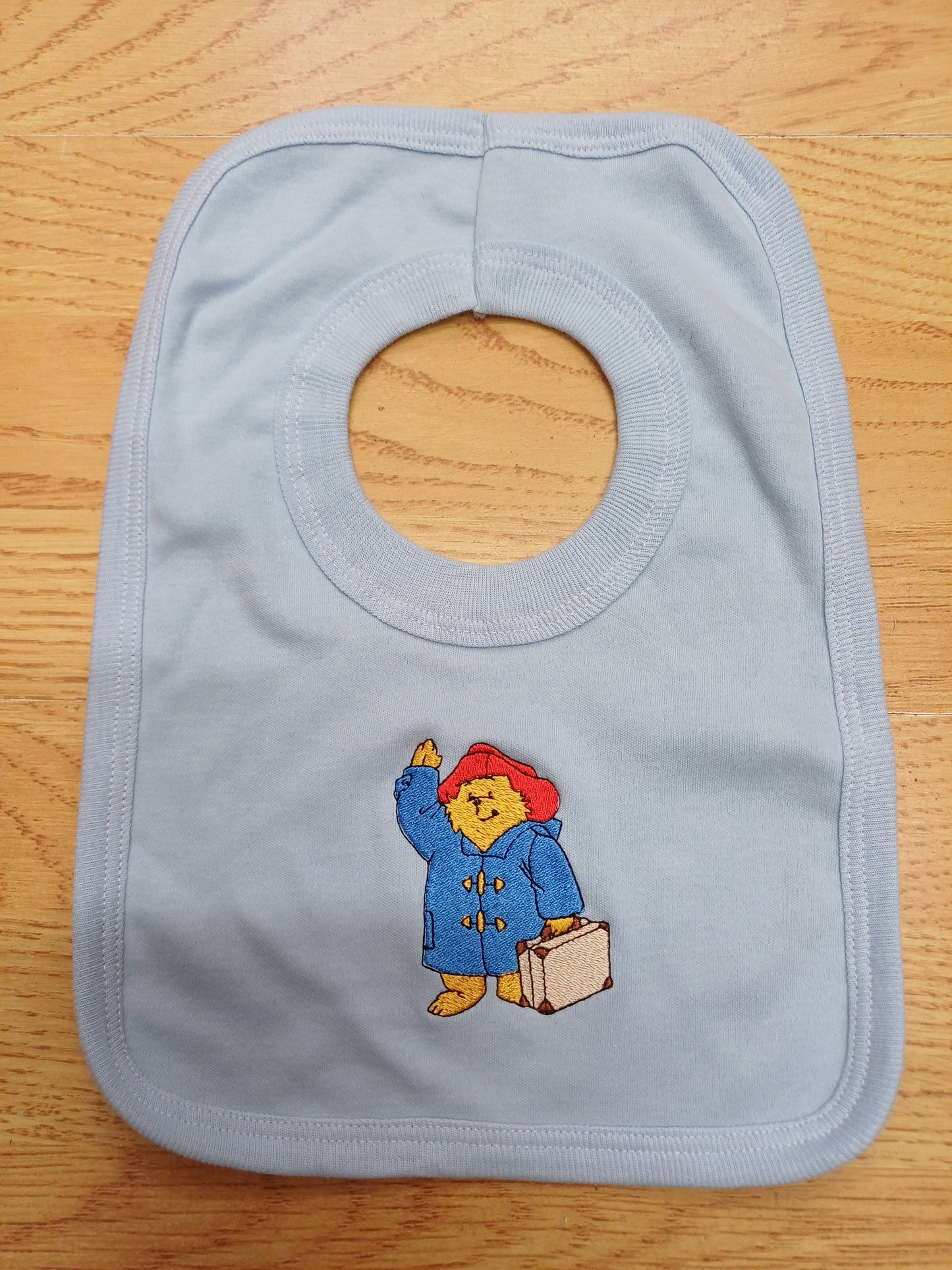 Babys bib embroidered with bear design