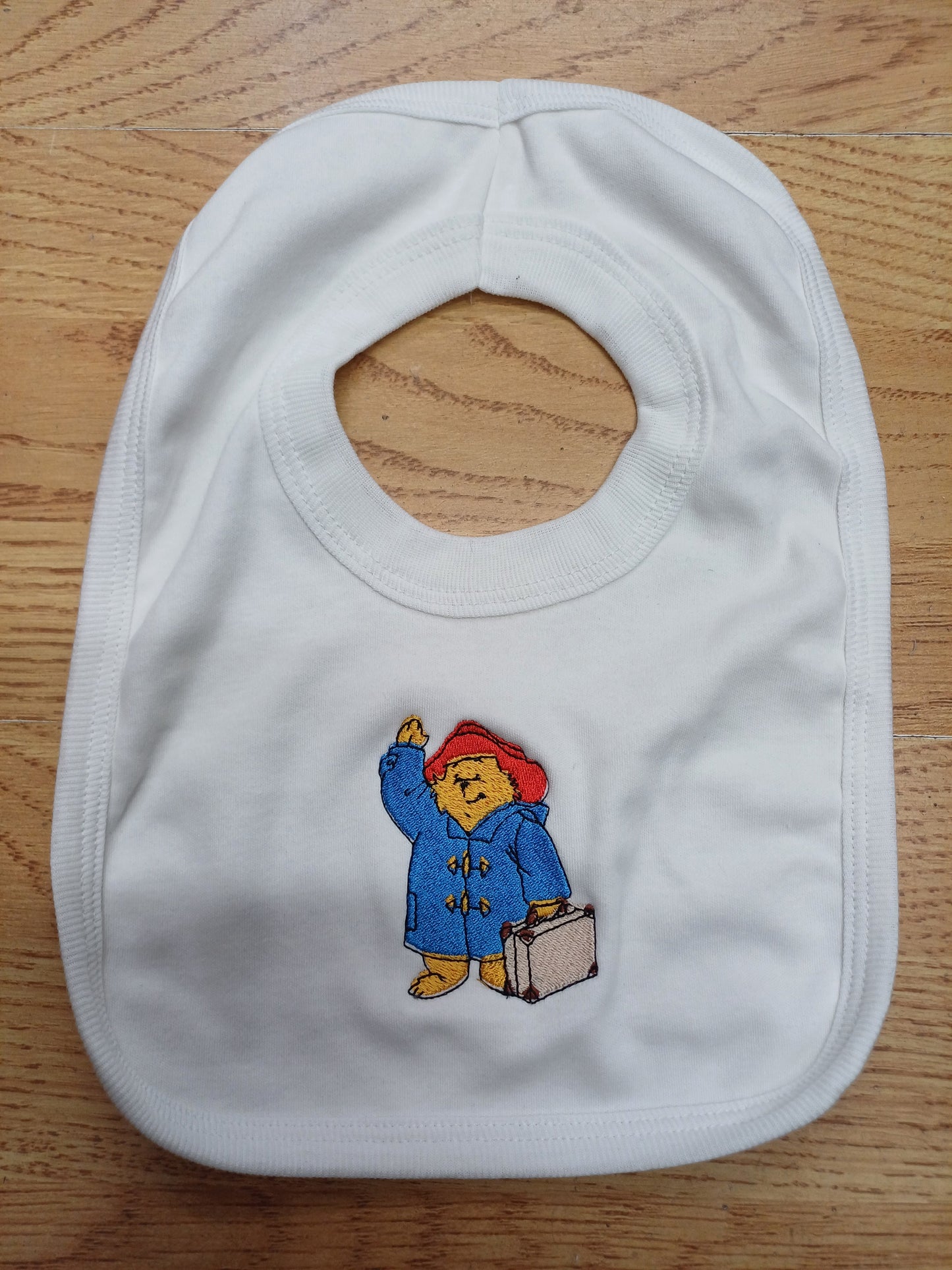 Babys bib embroidered with bear design