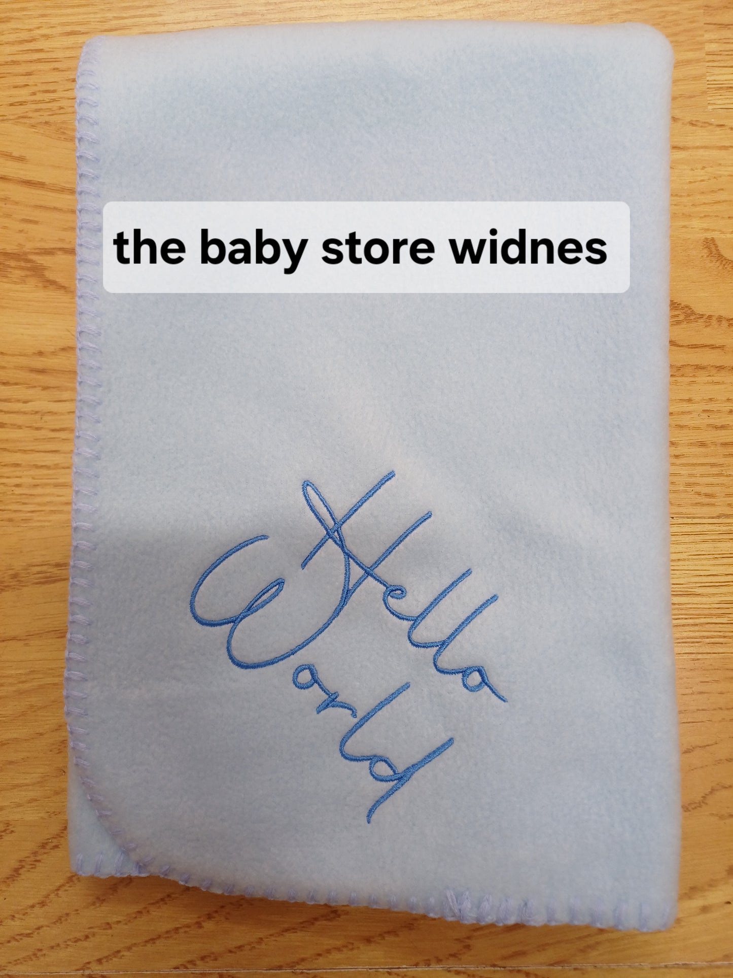 Babys fleece blanket / wrap embroidered with hello world