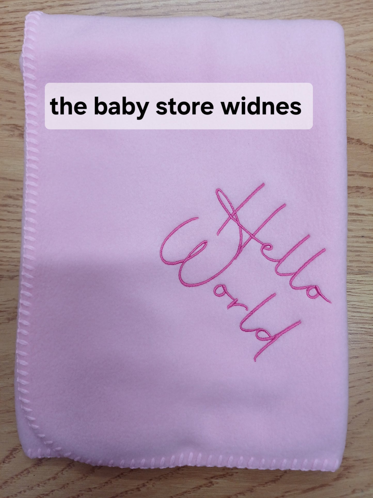 Babys fleece blanket / wrap embroidered with hello world