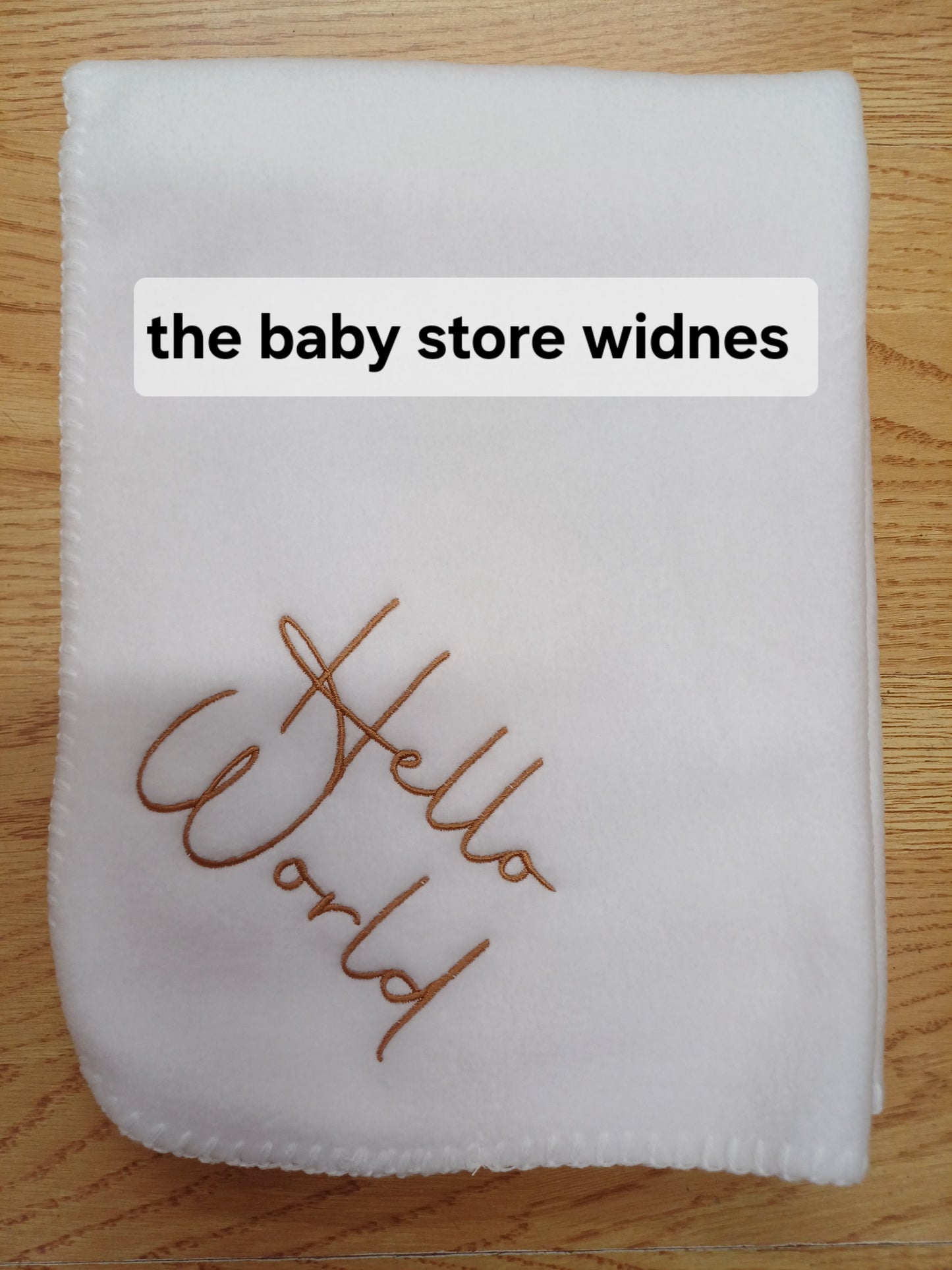 Babys fleece blanket / wrap embroidered with hello world