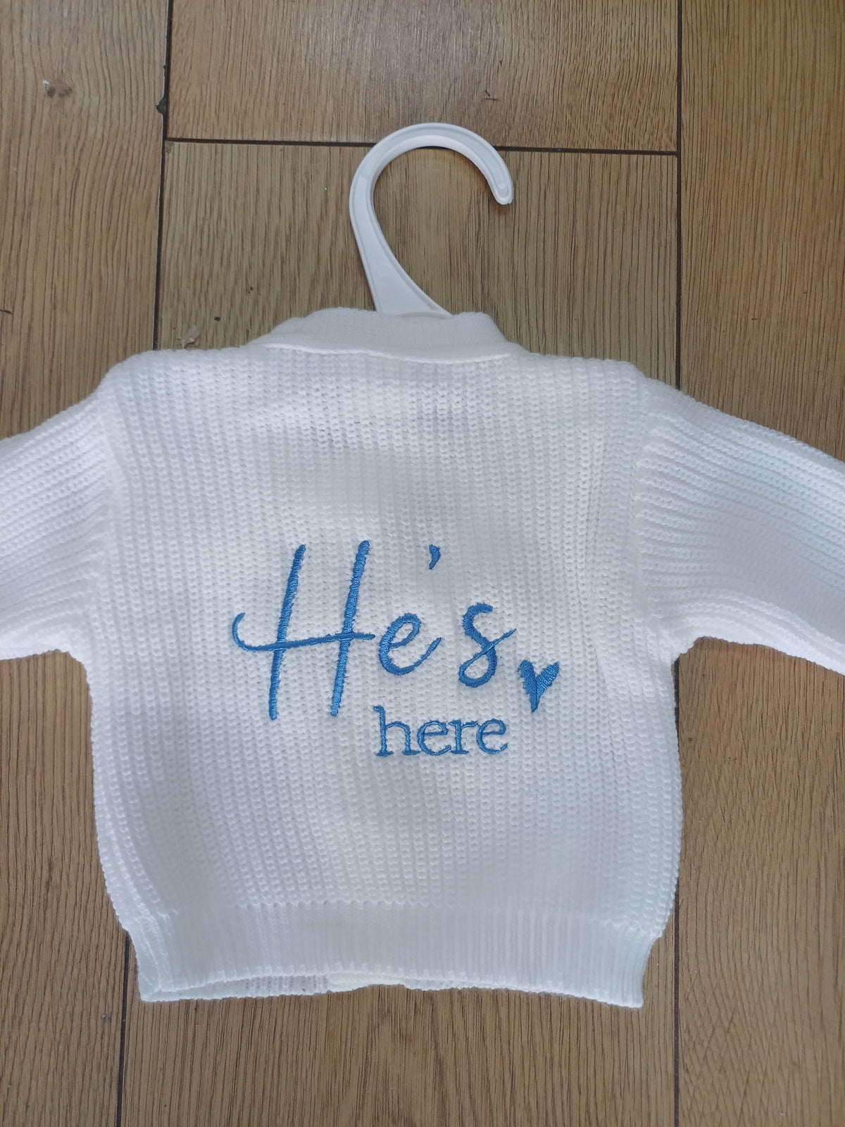 Babys knitted cardie with he's here or she's here embroidery