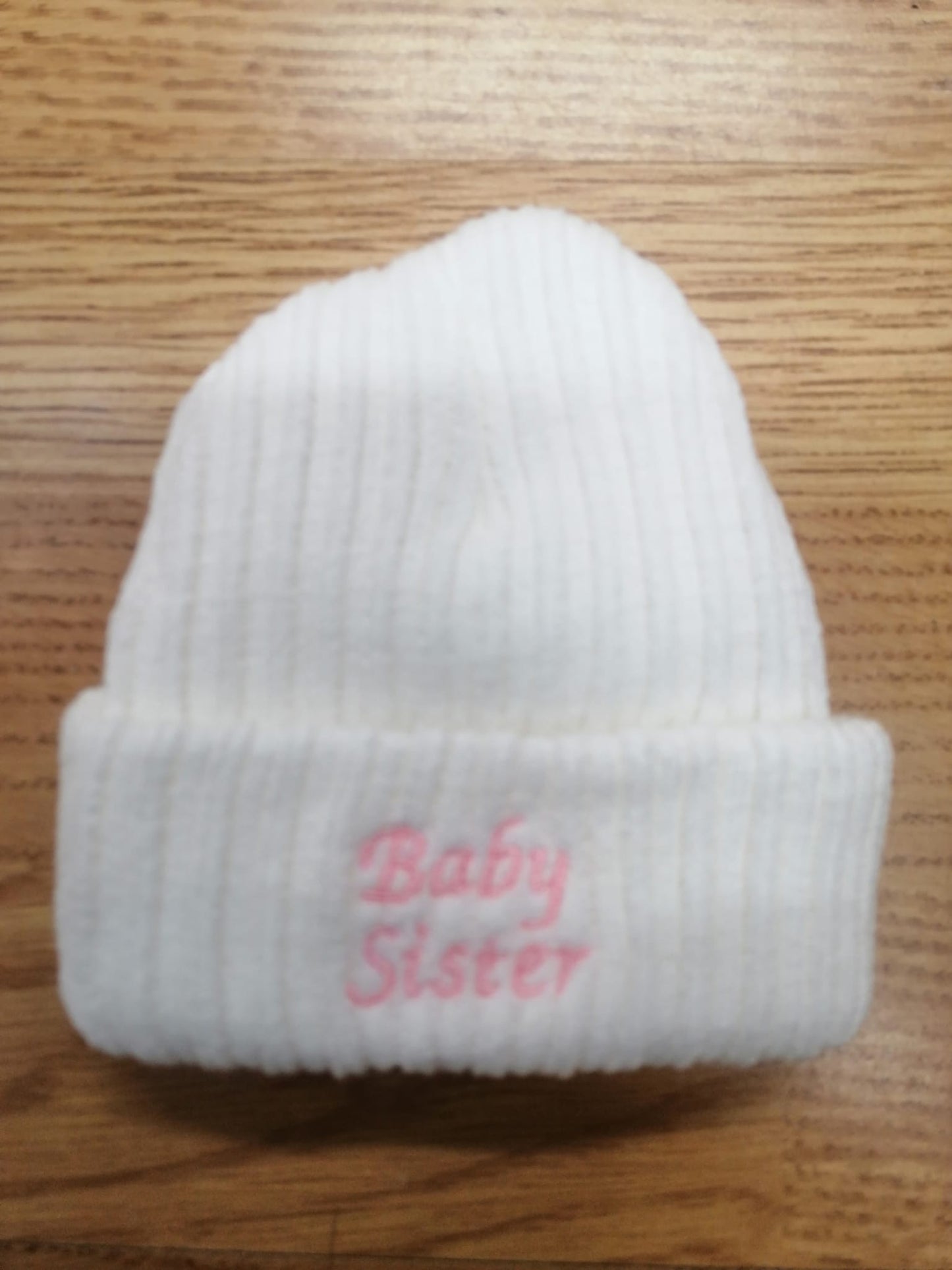 beautiful baby unisex beanie hat embroidered with baby sister or brother. newborn size