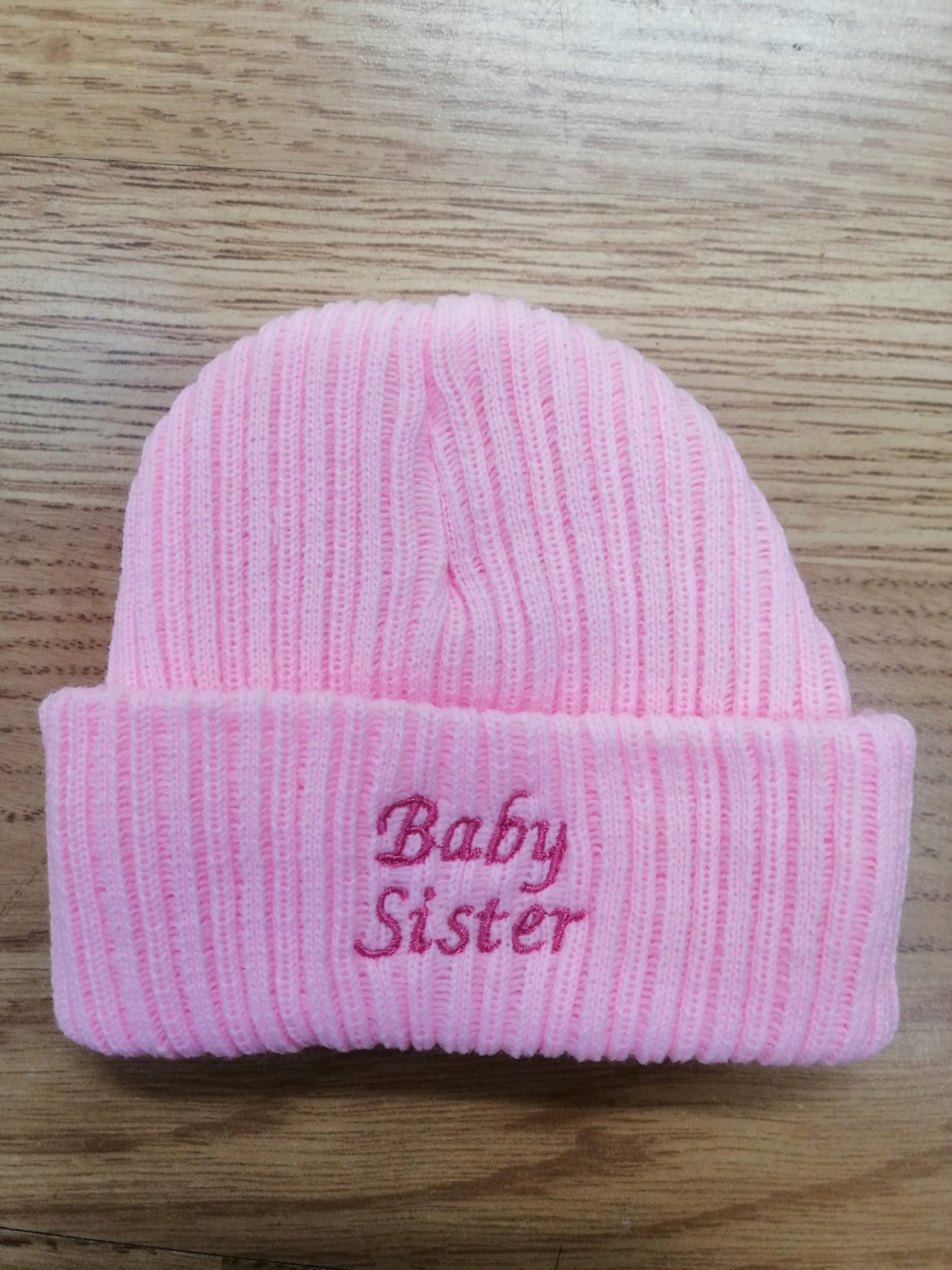beautiful baby unisex beanie hat embroidered with baby sister or brother. newborn size