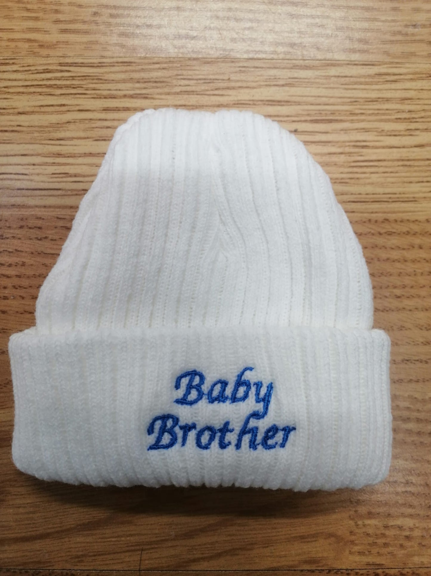 beautiful baby unisex beanie hat embroidered with baby sister or brother. newborn size