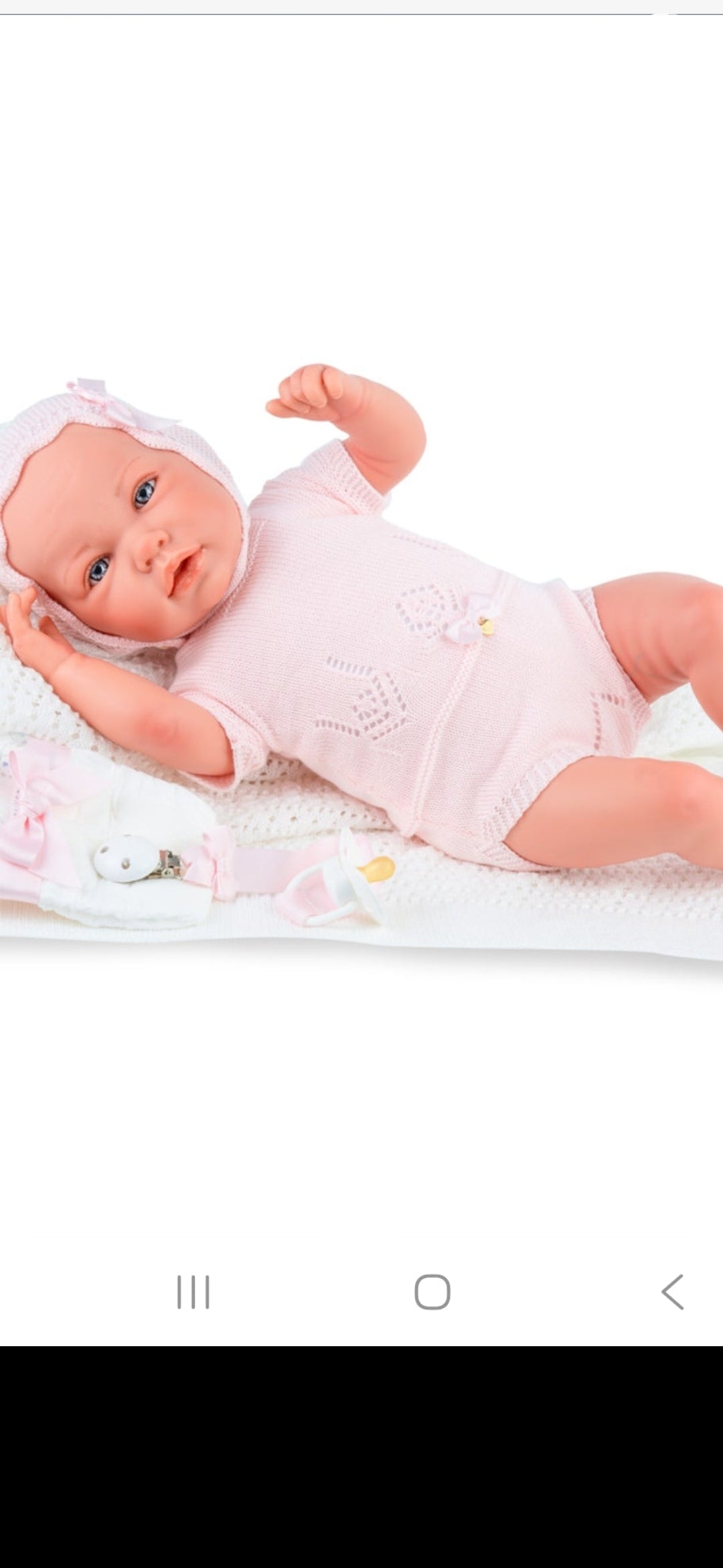 Spanish reborn doll comes with blanket and pacifier