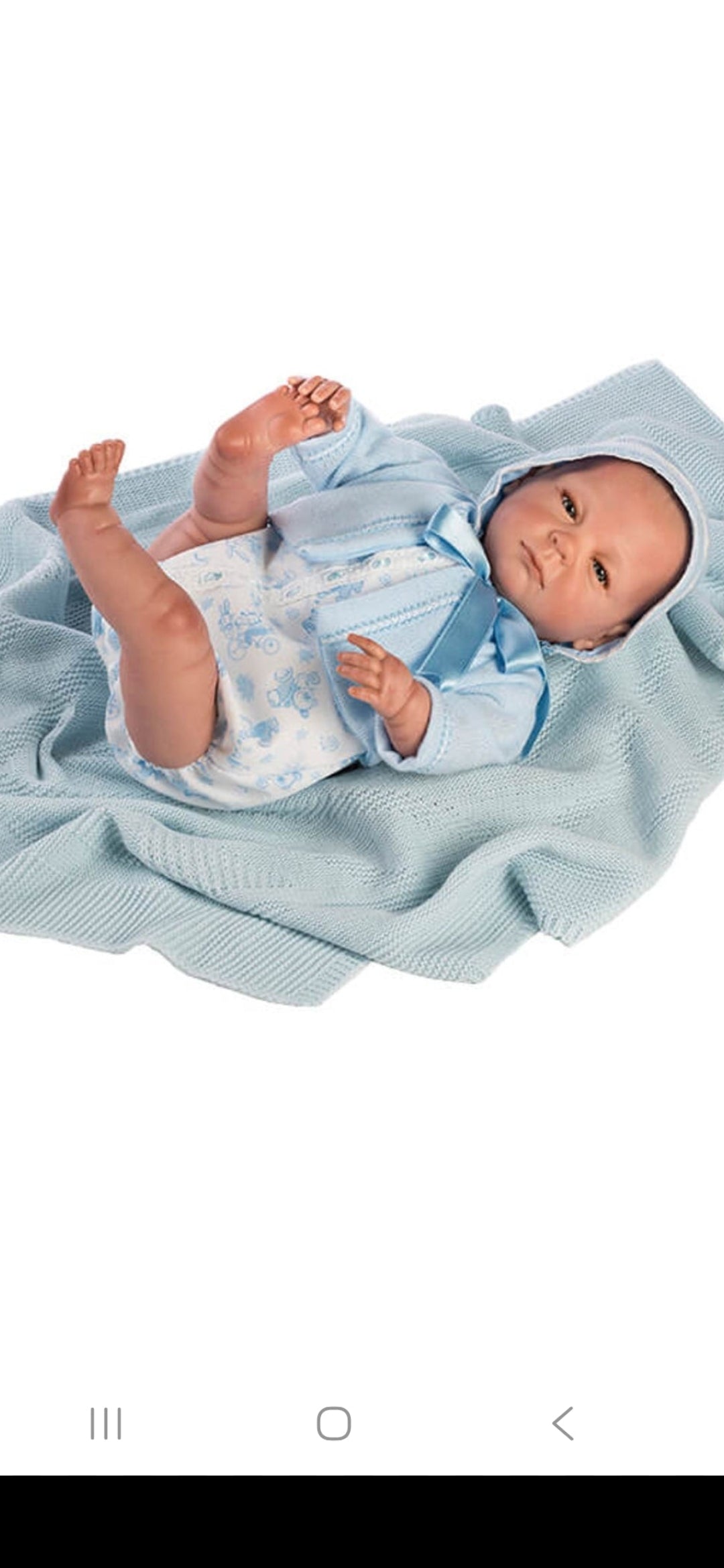 Spanish reborn doll with blanket