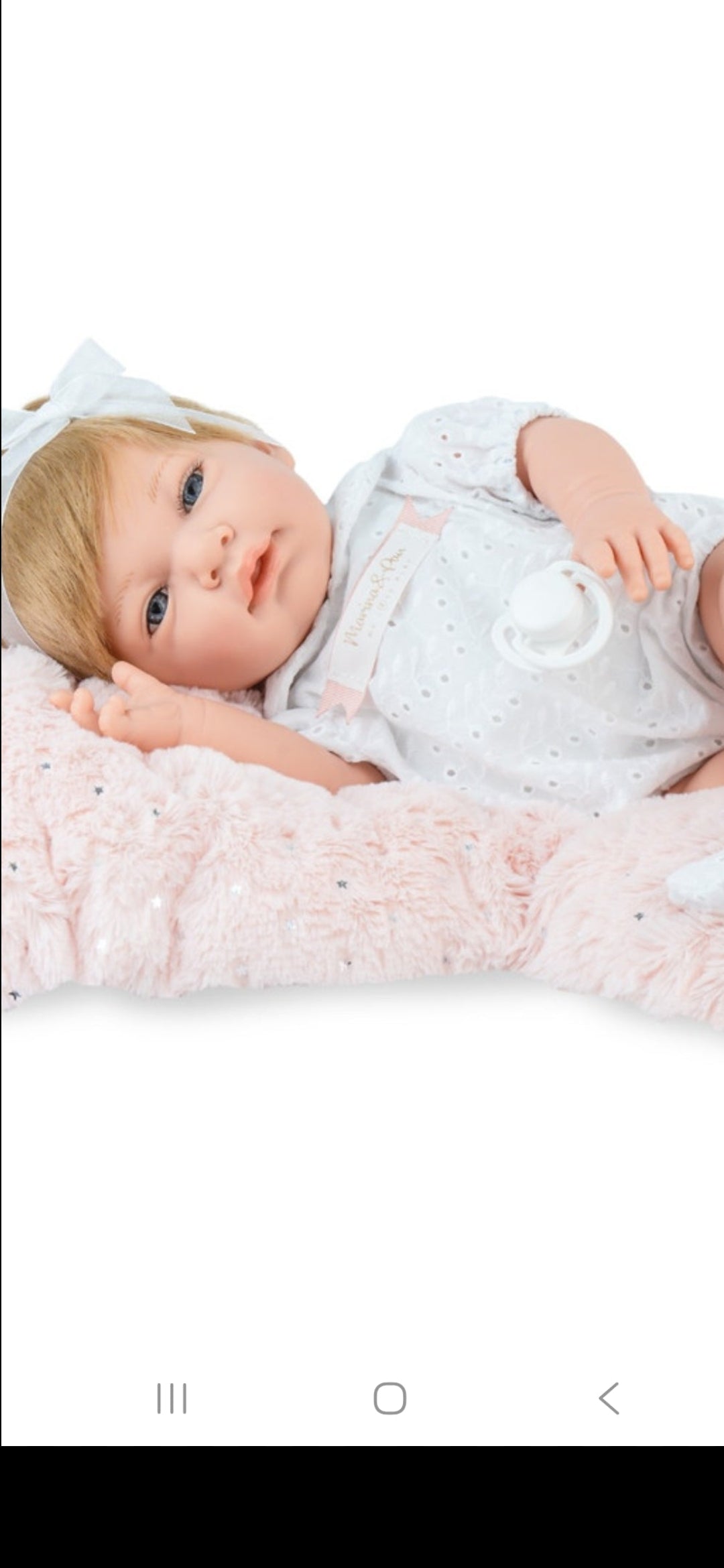 Spanish reborn doll comes with blanket and pacifier