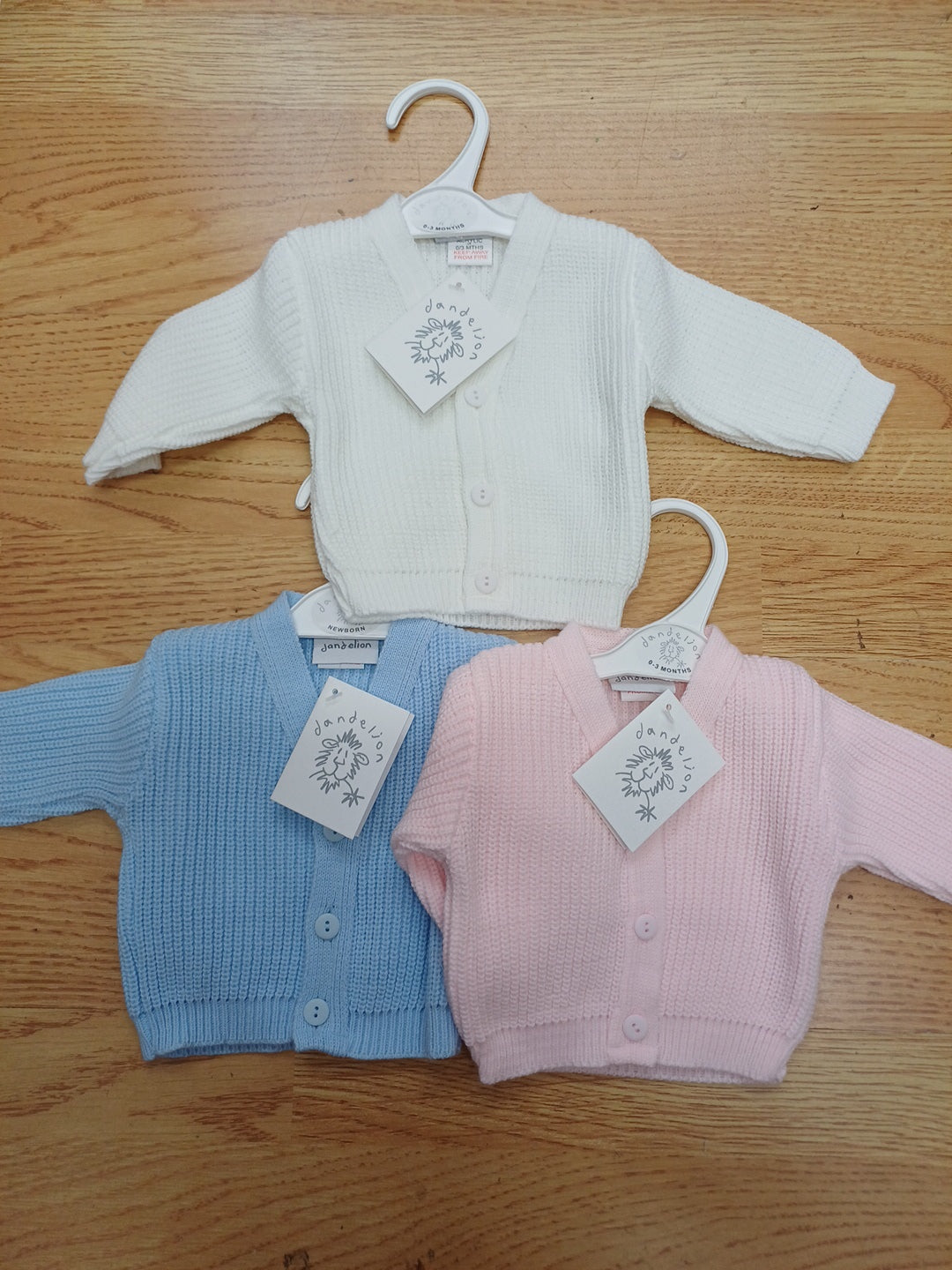 Dandelion babys knitted cardigans sizes from premature to 3 months various colours to choose from