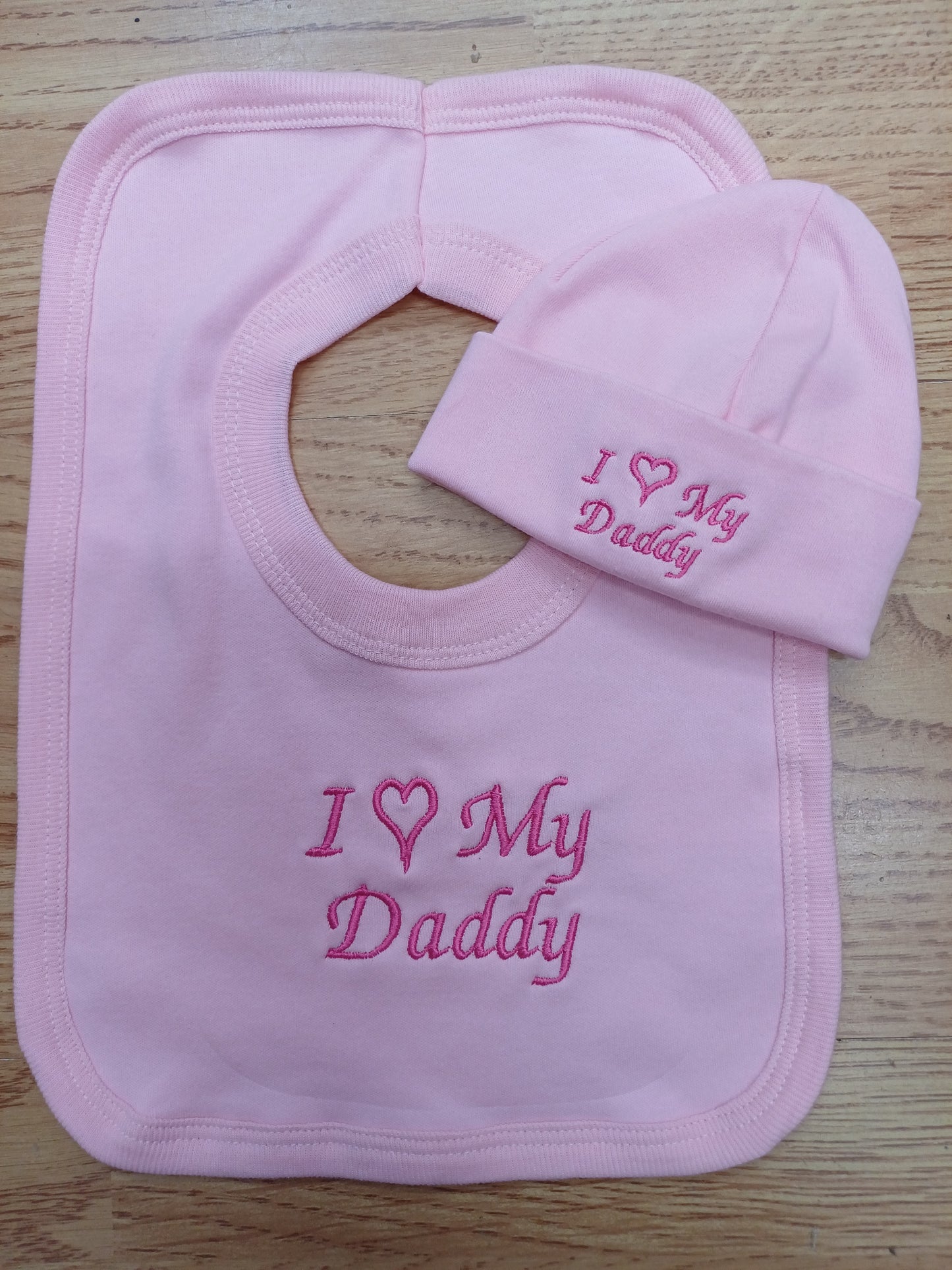 Baby girls  100 % soft cotton bib and hat set embroidered with I love my daddy colour pink  size newborn