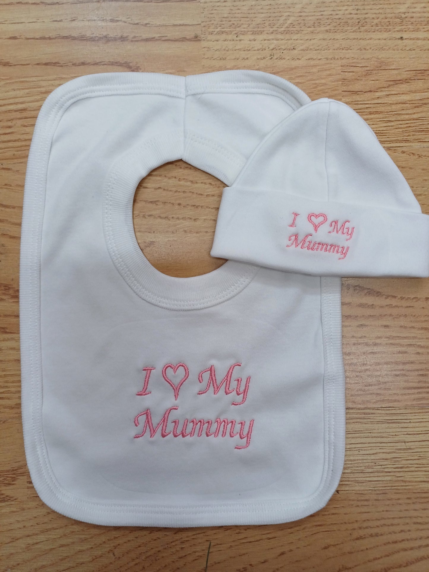 Baby girls  100 % soft cotton bib and hat set embroidered with I love my mummy colour white  / pink  size newborn