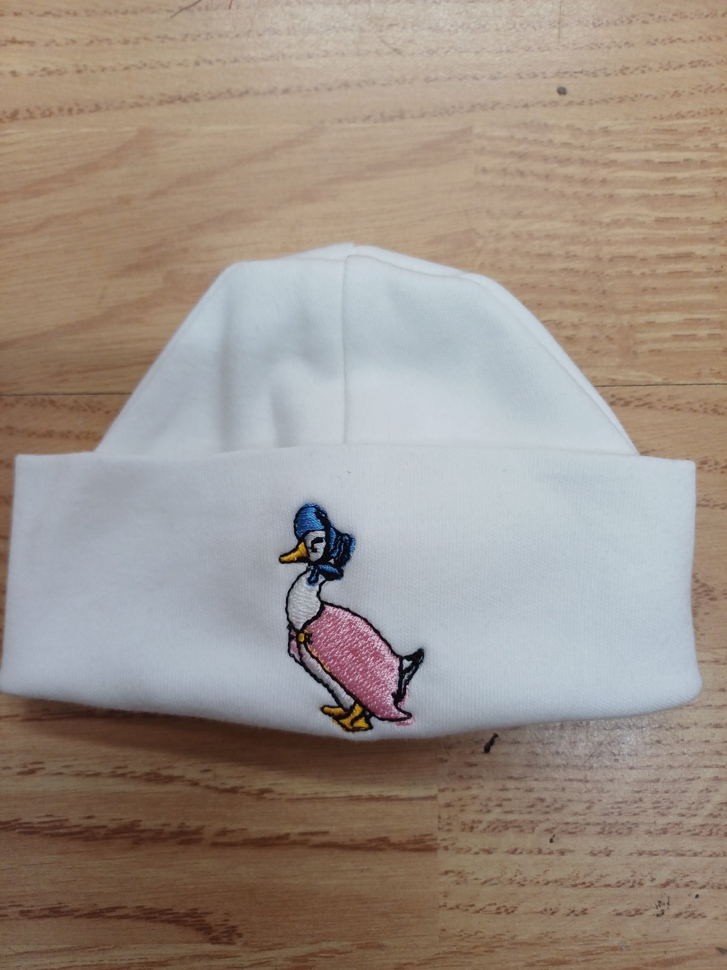 Baby Boys or girls  100 % soft cotton hat embroidered with peter rabbit or jemima puddle duck size newborn