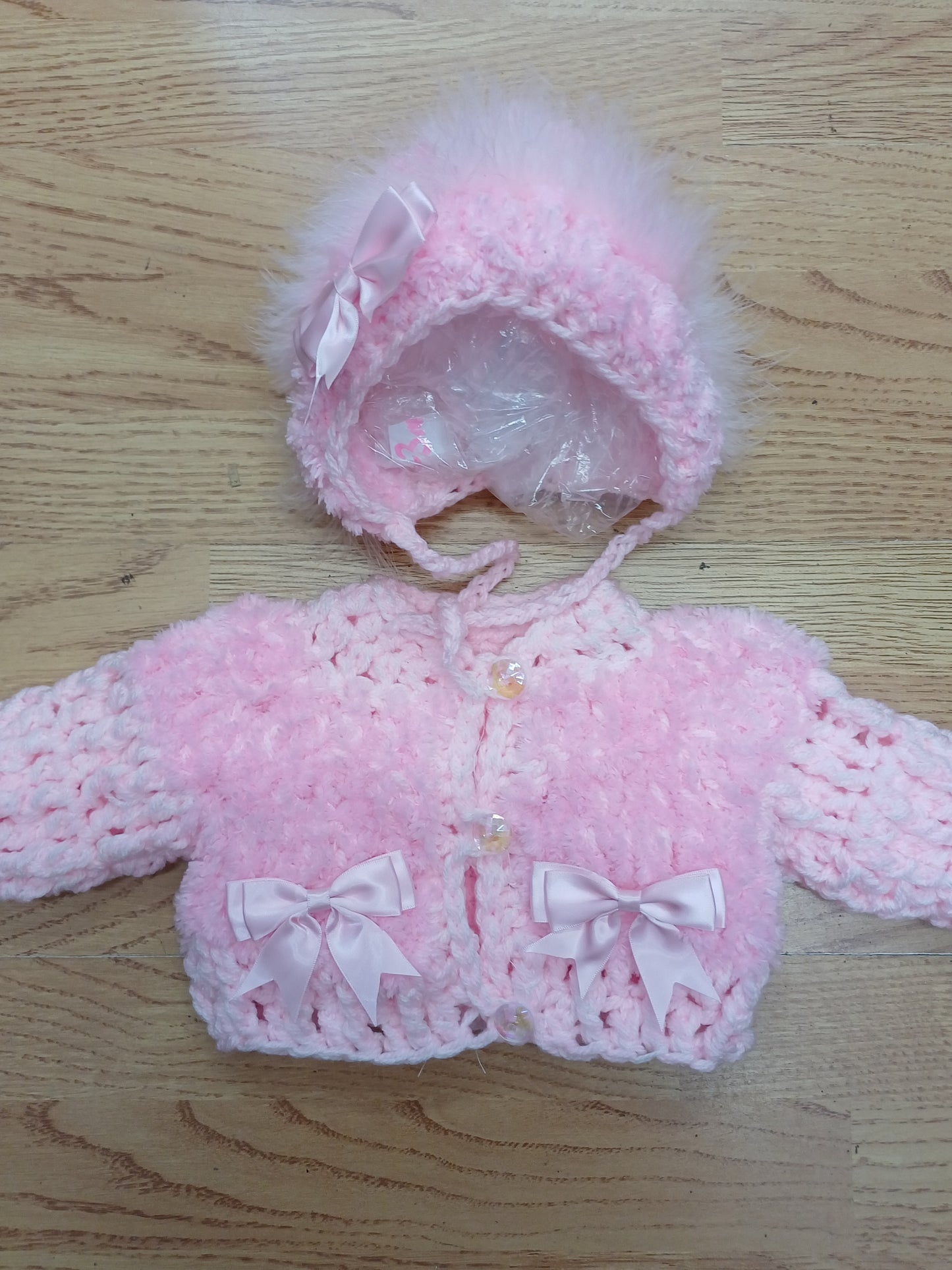 Baby girls handmade crochet pretty cardigan  and bonnet set  size  newborn