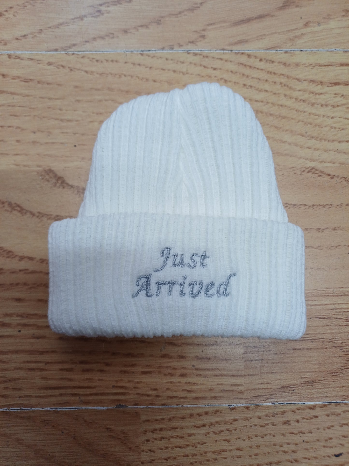 Babys  unisex knitted beanie hat embroidered with just arrived  or hello world size newborn