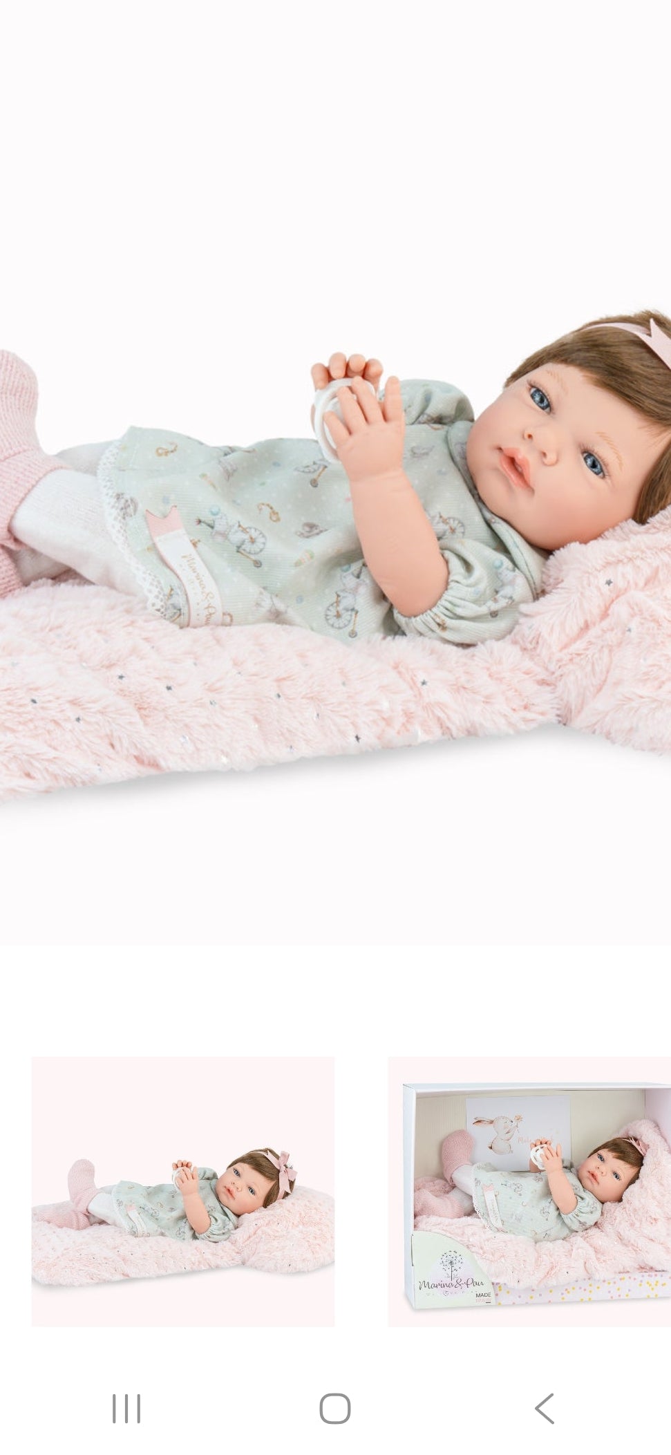 Spanish reborn doll comes with pacifier and blanket