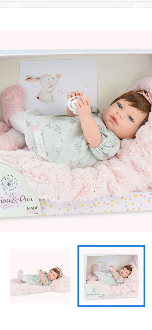 Spanish reborn doll comes with pacifier and blanket