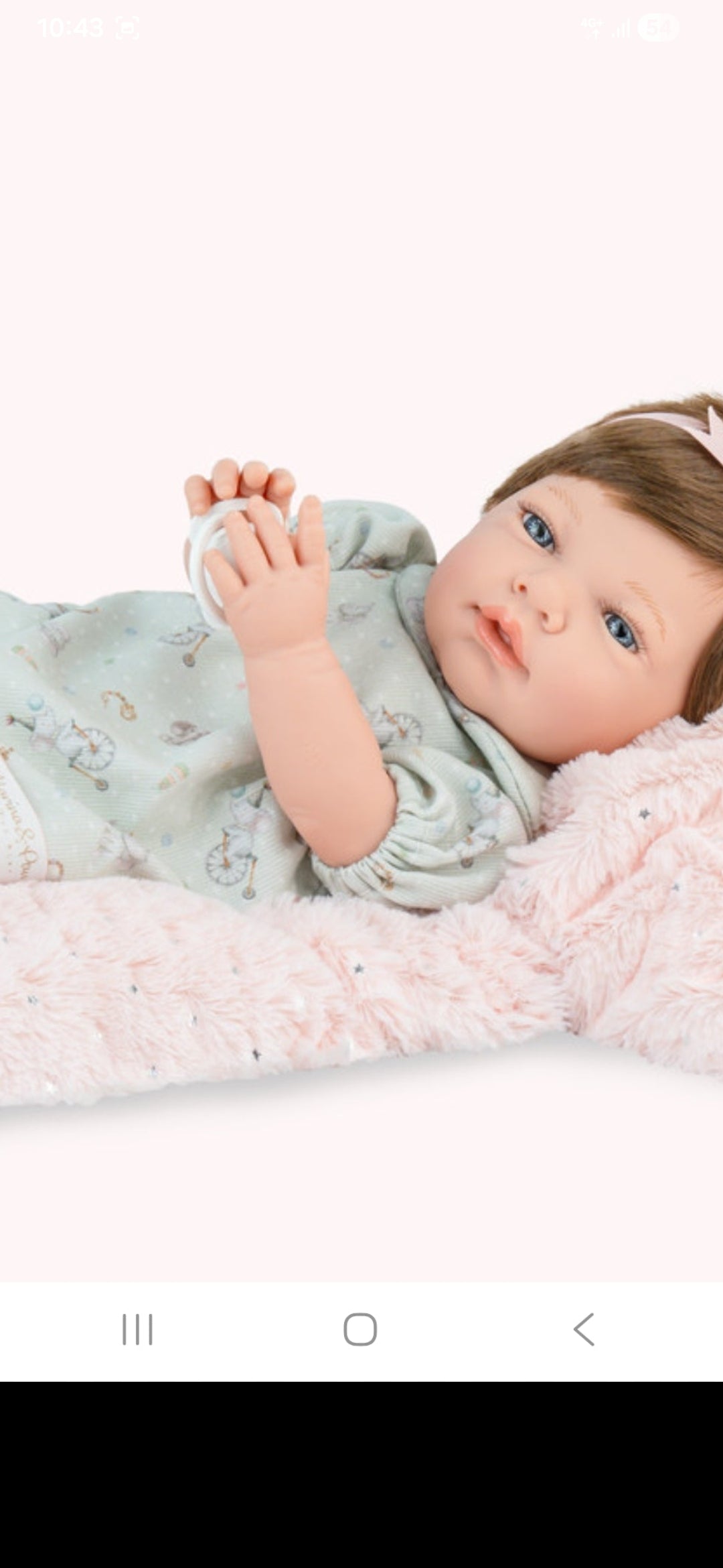 Spanish reborn doll comes with pacifier and blanket